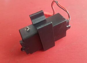 black plastic transponder box in a 3d printed mount